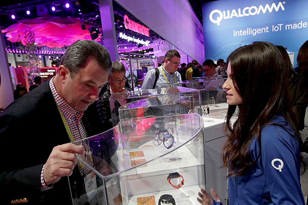 Attendees visit the Qualcomm booth during CES 2017 at the Las Vegas Convention Center in Las Vegas, Nevada.(Photo provided to China Daily)