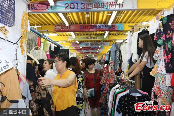 Zhonghe, a section of the sprawling Beijing Zoo clothing wholesale market, is closed on July 30 after operating for 18 years, part of a wider push to upgrade Beijings urban amenities.   (Photo/VCG)