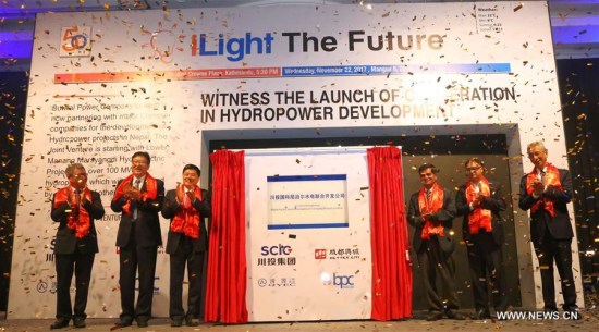 Liu Guoqiang (3rd L), chairman of China's Sichuan Provincial Investment Group Co. Ltd (SPIG) board, Nepal's Butwal Power Company (BPC) Chairman Padma Jyoti (1st R) and other delegates launch a joint venture between Chinese companies and Butwal Power Company (BPC) in Kathmandu, capital of Nepal, on Nov. 22, 2017. (Xinhua/Sunil Sharma)
