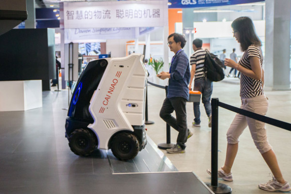 A forum on intelligent logistics, held in Hangzhou in May, attracted both logistics robot manufacturers and general public. Cainiao, the logistics arm of Alibaba, employs robots. (Photo provided to China Daily)