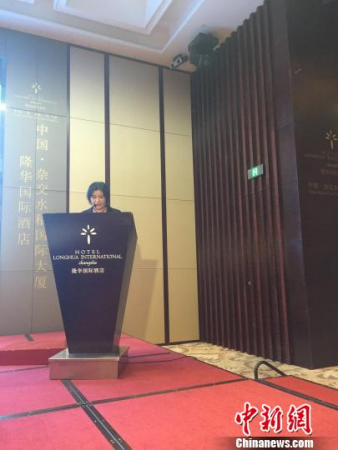 Zhou Qunfei, CEO of Lens Technology, speaks at a business meeting, Nov 6, 2015 in Liuyang, Hunan province. [Photo/China News Service]