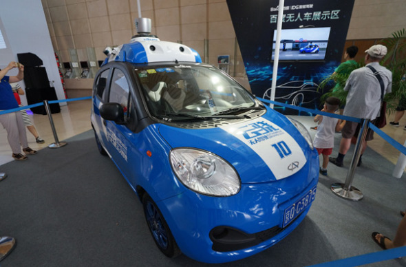 Baidu Inc's autonomous car at an exhibition in Tianjin. The internet company is pushing forward the research and development of autonomous driving technology. (Photo by Li Shengli/For China Daily)