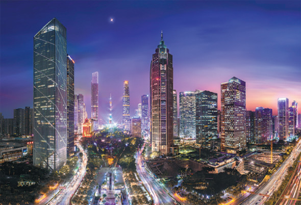 Bustling downtown Guangzhou. The southern city has released innovative policies to spur high-quality growth in the local economy. (Photo by Yang Yi/For China Daily)