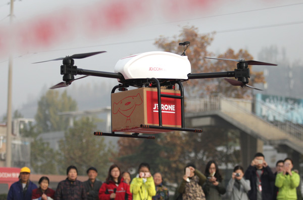 A JD drone being used to deliver packages to customers in Shaanxi province. The company has been using drone services for deliveries in several provinces. (Photo by Chen Feibo/For China Daily)