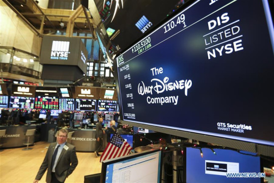 A display with the stock trading data of the Walt Disney Company is seen in New York Stock Exchange, New York, the United States, on Dec. 14, 2017. The Walt Disney Company announced Thursday a deal to acquire many parts of Twenty-First Century Fox for 52.4 billion U.S. dollars in stock. (Xinhua/Wang Ying)