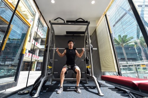A man exercises in a Supermonkey cube-like gym at an office building compound area in Shenzhen, South China's Guangdong Province. (Photo/Xinhua)