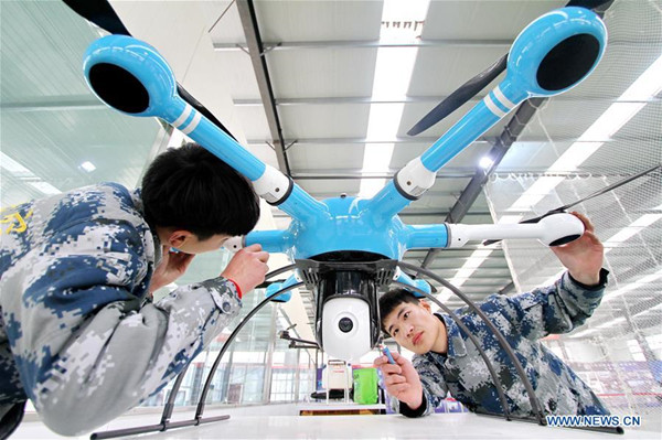 Technicians work on an unmanned aerial vehicle, north China's Hebei Province, Dec. 26, 2017. China's economy grew 6.9 percent year on year in 2017, well above the official target of around 6.5 percent, data from the National Bureau of Statistics (NBS) showed Thursday. Gross domestic product (GDP) totaled 82.71 trillion yuan (about 12.84 trillion U.S. dollars) in 2017, with the service sector accounting for more than half of the total. (Xinhua/Mu Yu)