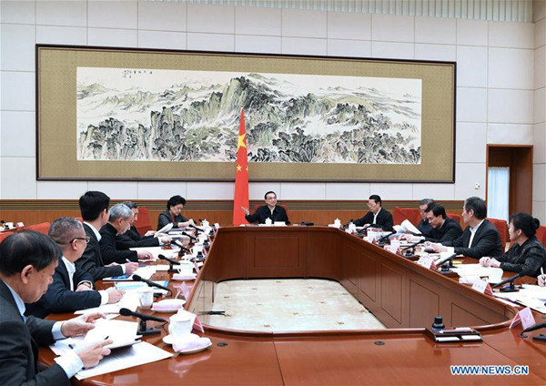 Chinese Premier Li Keqiang presides over a meeting with economic experts and entrepreneurs to collect opinions on the annual government work report scheduled to be published in March, in Beijing, capital of China, Jan. 22, 2018. Chinese Vice Premier Zhang Gaoli and Wang Yang, a member of the Standing Committee of the Political Bureau of the Communist Party of China (CPC) Central Committee and vice premier, also attended the meeting. (Xinhua/Rao Aimin)