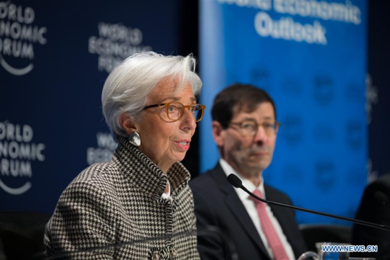 Managing Director of the International Monetary Fund (IMF) Christine Lagarde (L) and IMF Economic Counsellor and Director of Research Maurice Obstfeld attend a press conference on Update of the World Economic Outlook in Davos, Switzerland, Jan. 22, 2018. (Xinhua/Xu Jinquan)