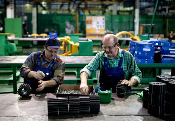 Employees work at a factory purchased by Chinese machinery equipment manufacturer Liugong Machinery Co Ltd, in Stalowa Wola, Poland. (Photo/Xinhua)