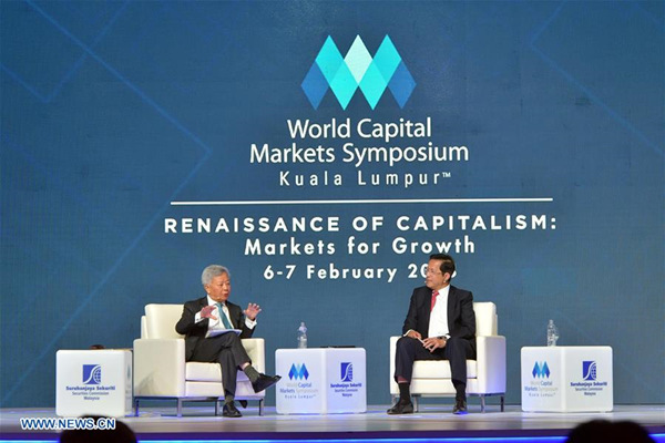 President of the Asian Infrastructure Investment Bank (AIIB) Jin Liqun (L) speaks at the World Capital Market Symposium in Kuala Lumpur, Malaysia, Feb. 6, 2018. The Asian Infrastructure Investment Bank (AIIB) will work with Malaysia, one of the founding members, to seek ways to support infrastructure development in the ASEAN region, said the bank's president Jin Liqun on Tuesday. (Xinhua/Chong Voon Chung)
