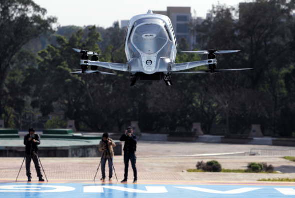 An Ehang 184 autonomous aerial vehicle performs a test flight in Guangzhou, Guangdong province. (Photo by WU WEIHONG/FOR CHINA DAILY)