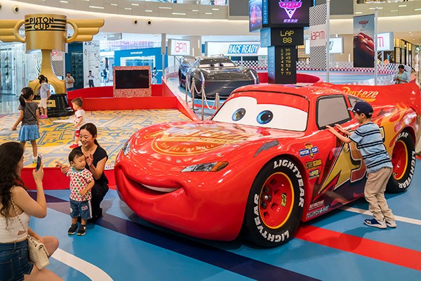 An exhibition themed on the Disney movie Cars attracts onlookers in Shanghai. (Photo/China Daily)