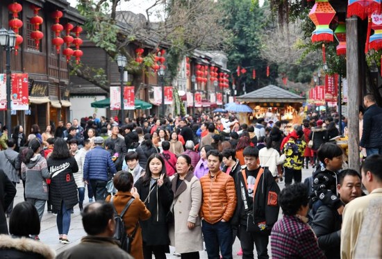 Tourists visit the SanfangQixiang (Three Lanes and Seven Alleys), a scenic spot in Fuzhou, capital of southeast China's Fujian Province, Feb. 21, 2018. (Xinhua/Lin Shanchuan)