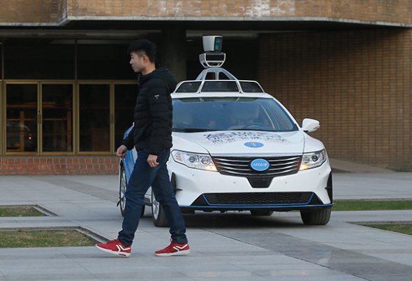 A self-driving car prototype developed by Xi'an Jiaotong University. The car can avoid obstacles and back into a garage automatically. (ZHANG JIE/FOR CHINA DAILY)