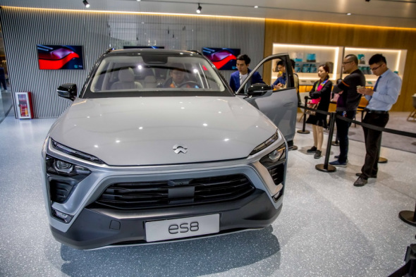 Visitors get up close with Chinese electric vehicle startup Nio's ES8 SUV at an auto show in Guangzhou. (Photo provided to China Daily)