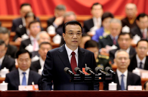 Premier Li Keqiang delivers the Government Work Report at the opening meeting of the first session of the 13th National People's Congress at the Great Hall of the People in Beijing on Monday. (Photo by Xujingxing/China Daily)