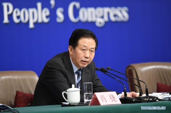 Chinese Finance Minister Xiao Jie answers questions at a press conference on reform of fiscal and taxation system and financial work during the first session of the 13th National People's Congress in Beijing, capital of China, March 7, 2018. (Xinhua/Shen Hong)