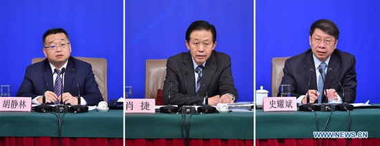 Combined photo shows Chinese Finance Minister Xiao Jie (C) and vice finance ministers Shi Yaobin (R) and Hu Jinglin anwsering questions at a press conference on reform of fiscal and taxation system and financial work during the first session of the 13th National People's Congress in Beijing, capital of China, March 7, 2018. (Xinhua/Li Xin)
