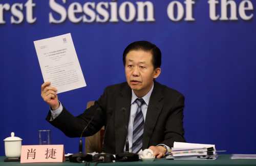 Finance Minister Xiao Jie speaks at a news conference of the first session of the 13th National People's Congress in Beijing, capital of China, March 7, 2018. (Photo by Feng Yongbin/China Daily)