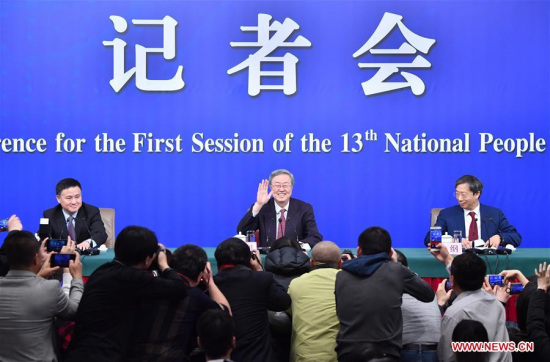 Zhou Xiaochuan (C), governor of the People's Bank of China (PBOC), Yi Gang (R), deputy governor of the PBOC and Pan Gongsheng, deputy governor of the PBOC and head of the State Administration of Foreign Exchange, attend a press conference on financial reform and development on the sidelines of the first session of the 13th National People's Congress in Beijing, capital of China, March 9, 2018. (Xinhua/Li Xin)