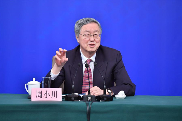 Zhou Xiaochuan, governor of the People's Bank of China (PBOC), answers questions at a press conference on financial reform and development on the sidelines of the first session of the 13th National People's Congress in Beijing, capital of China, March 9, 2018. (Xinhua/Li Xin)