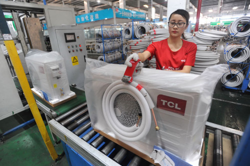 An employee works on a TCL air conditioner production line in Wuhan, capital of Hubei Province. (Photo provided to China Daily)