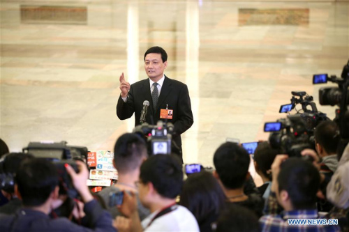 Xiao Yaqing, head of the State-owned Assets Supervision and Administration Commission (SASAC), receives an interview after the fourth plenary meeting of the first session of the 13th National People's Congress (NPC) at the Great Hall of the People in Beijing, March 13, 2018. (Photo/Xinhua)