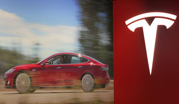 The Tesla logo is pictured on Feb 5, 2014 in its first Chinese mainland show room in Beijing. (Photo:chinadaily.com.cn/Hao Yan)