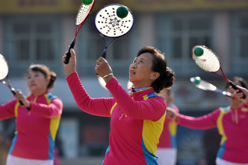 Retirees and homemakers practise taichi at a playground in Chaohu, Anhui Province. (Photo by Li Yuanbo/For China Daily)