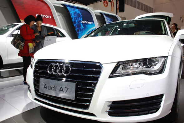 Visitors admire an Audi A7 produced by FAW-Volkswagen Group at an auto show in Haikou, Hainan province. (Photo provided to China Daily)
