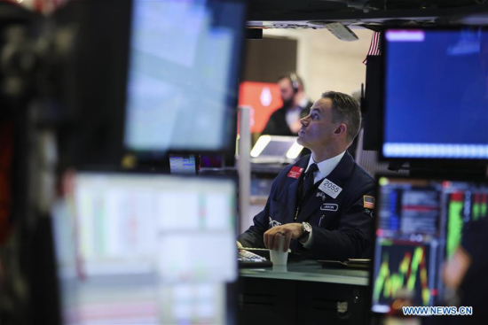 A trader works at the New York Stock Exchange in New York, the United States, on April 10, 2018. (Xinhua/Wang Ying)