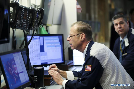 Traders work at the New York Stock Exchange in New York, the United States, on April 10, 2018.([Photo/Xinhua)