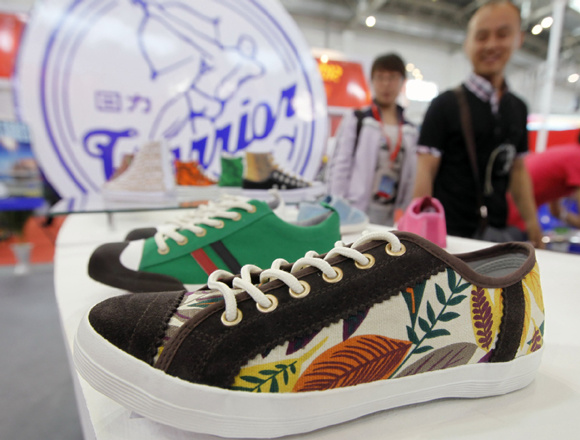 Warrior brand shoes displayed at an industry expo in Beijing. Photo by A Jing/For China Daily