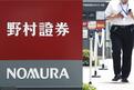 Japanese securities trader Nomura plans to set up holding firm in China