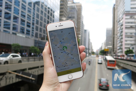 A user of Didi Chuxing App. showed her cell phone in San Paulo, Brazil. (Xinhua Photo) A user of Didi Chuxing App. showed her cell phone in San Paulo, Brazil. (Xinhua Photo)