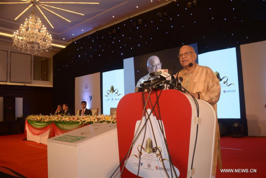 Bangladeshi Finance Minister AMA Muhith (R) delivers a speech at the signing ceremony in Dhaka, Bangladesh, on May 14, 2018.  (Xinhua)