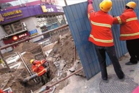 Workers are fencing around the accident scene.