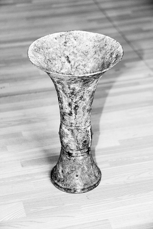 bronze Chinese drinking vessel, slender and tall, about 3000 years old