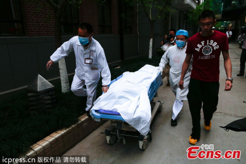 The body of Huang Yang, who local police believe was poisoned by a roommate, is moved to the mortuary at the Zhongshan Hospital in Shanghai, April 16, 2013. Huang Yang, 28, in his third year at Fudan University's medical school, died at about 3:23 p.m. p.
