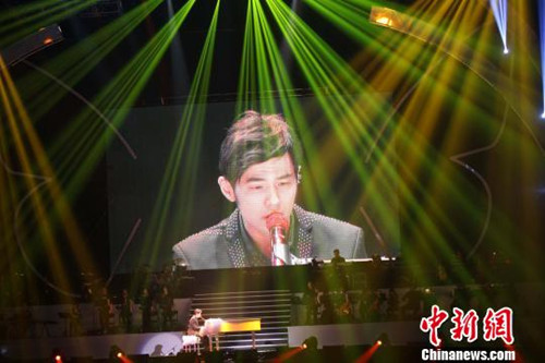 Jay Chou performs during a memorial concert for Teresa Teng held in the Taipei Arena, May 12, 2013.