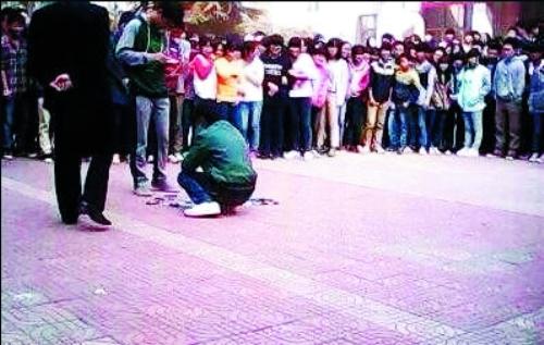 Pictures showing students and parents standing in a circle during the destruction were posted by a netizen named 