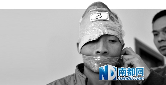 A suspect had his mouth covered with tape.