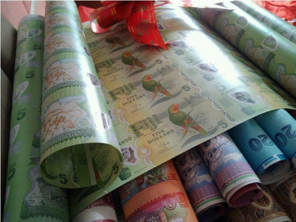 Sheets of uncut foreign banknotes.