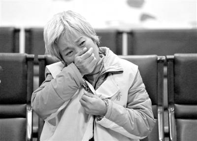 Wu Wenying stands on trial.