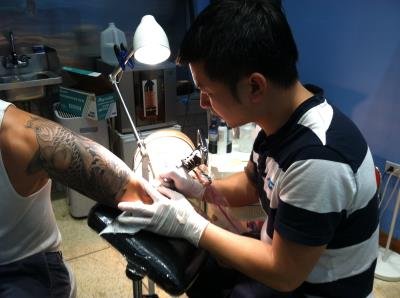 Chen Yao, a tattoo artist in New York.