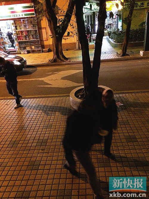 A foreigner is pestered by a beggar.