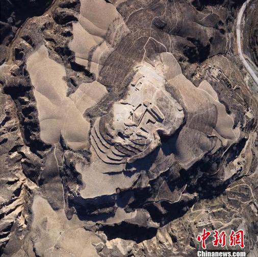 The photo taken from aerial shot shows the outline of the mega-construction ruins in Xinzhuang site, QIngjian county, Shaanxi province.