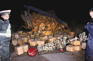 The truck lay on its side on a road, with cartons of Moutai falling out off. (Photo source: the Chongqing Evening News)