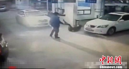 The man slaps the woman to the ground in the screenshot of video.